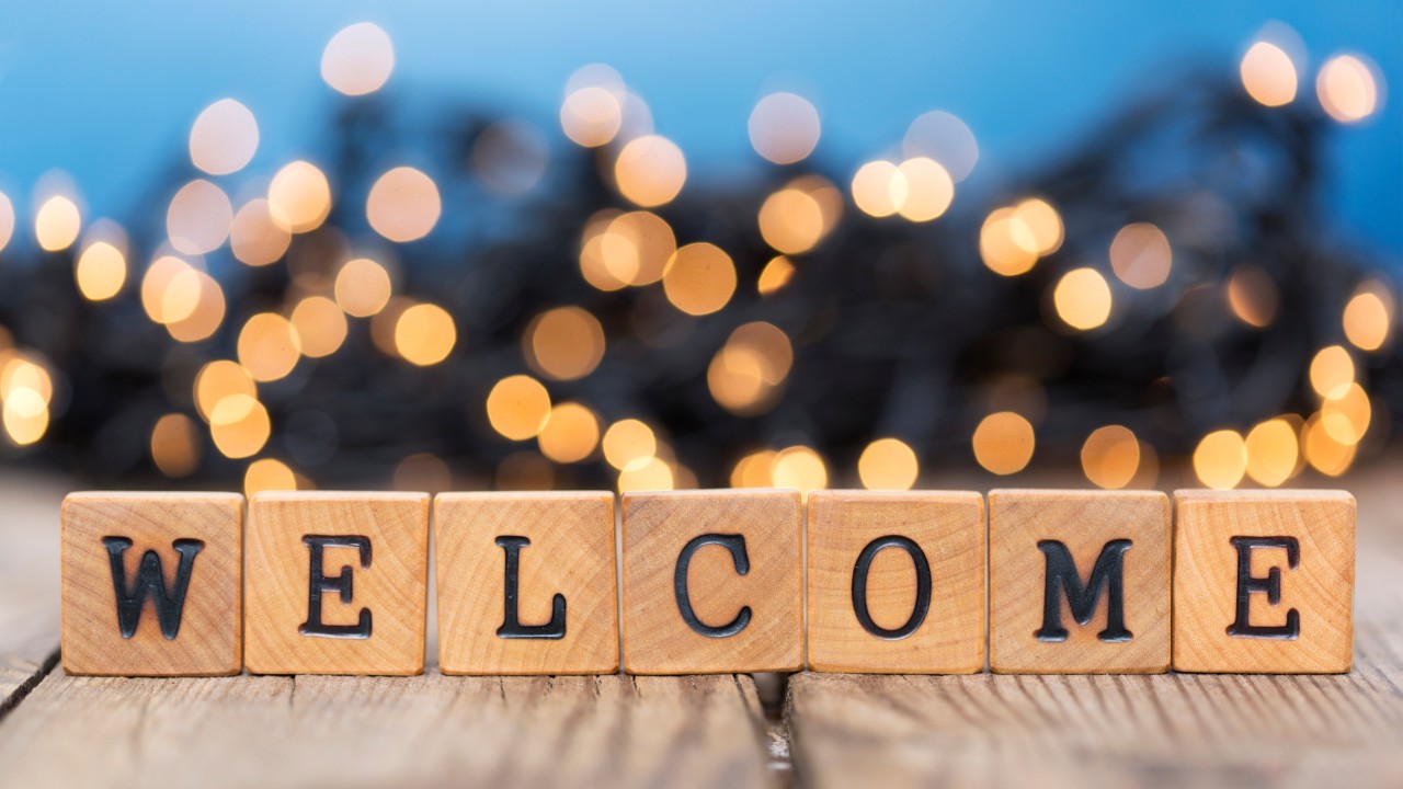 wooden blocks spelling welcome