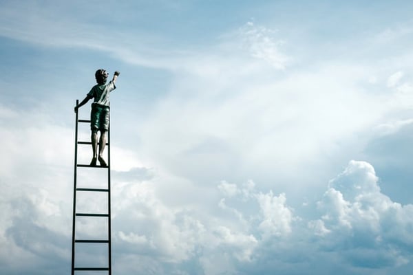 child climbing a ladder into the sky