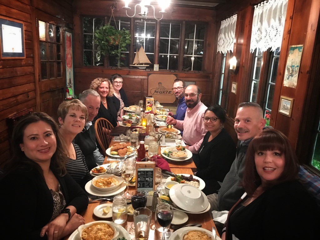 members enjoying dinner out together